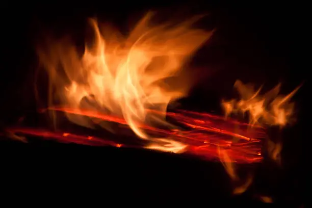 Orange flames of fire burning in woodstove
