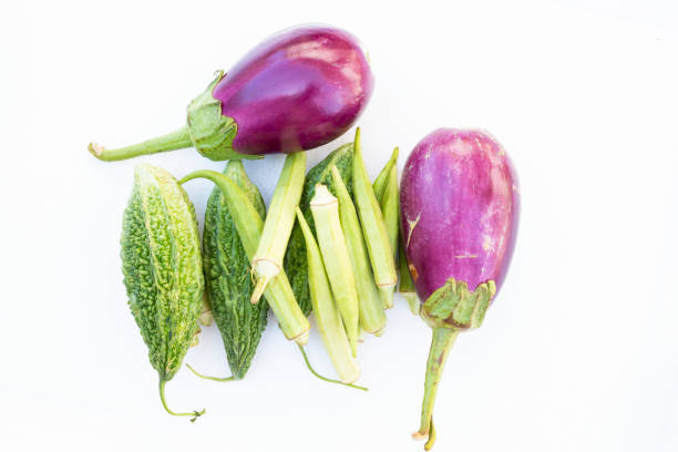 istock Okra (Abelmoschus esculentus), Eggplant (Solanum melongena) and Bitter melon (Momordica charantia) isolated on white background 1366895166