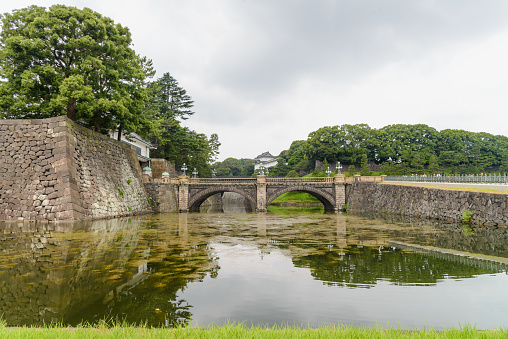 Moat and bridge - Tokyo Imperial Palace area located in the Chiyoda ward of Tokyo and contains buildings including the main palace, JAPANMoat and bridge - Tokyo Imperial Palace area located in the Chiyoda ward of Tokyo and contains buildings including the main palace, JAPAN