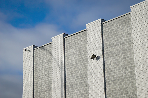 Modern urban brick building with blue sky