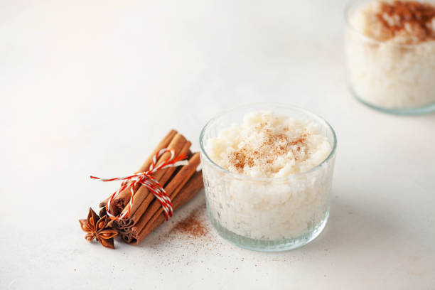 istock Rice porridge or pudding with cinnamon  in a bowl on the table.  Healthy breakfast. Top view 1366902282