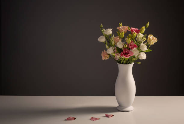 istock bouquet of eustoma on dark background 1366903325