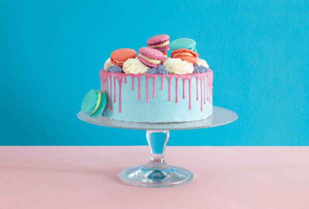 istock cake on plate on pink and blue background 1366903327