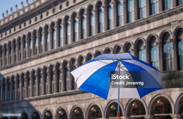Black White And Blue Umbrella In St Mark Square For Mardi Gras Parade Venice Italy Stock Photo - Download Image Now