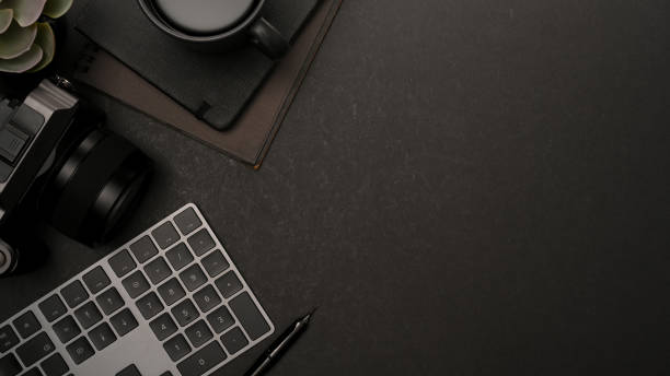 istock Modern workspace with photographer equipment and copy space 1366905314
