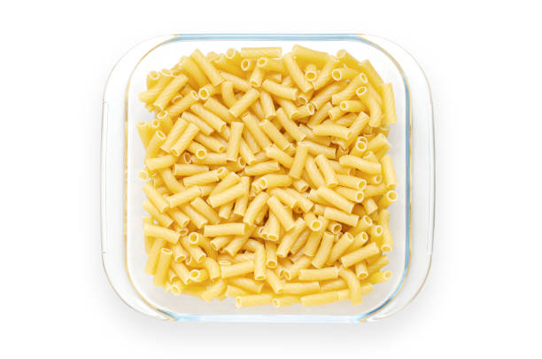 istock Pasta in a glass plate. Isolated on white. 1366907324
