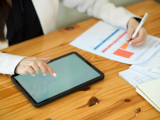 istock Cropped image of a female worker using digital tablet 1366907754