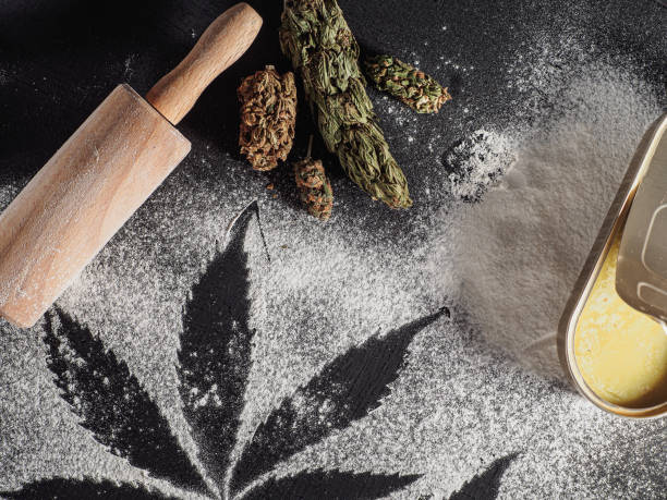 istock rustic cannabis butter and medical marijuana bud on black. 1366910638