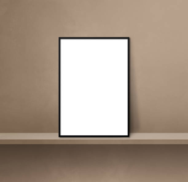 istock Black picture frame leaning on a brown shelf. 3d illustration. Square background 1366911261