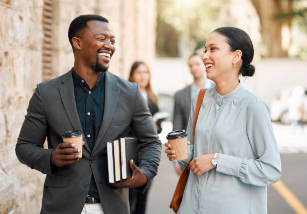 istock Shot of two lawyers walking to work while having a conversation 1366914640