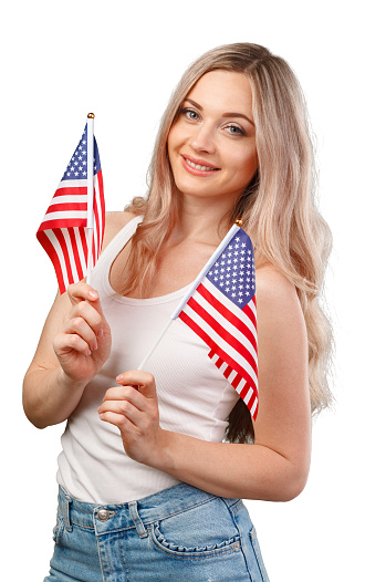 Portrait of a young smiling woman holding USA flag isolated on white background