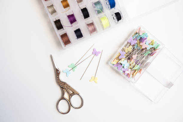 Woman embroidering a child's bib in cross stitch