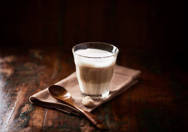 istock Coffee with milk on wooden background. Close up. 1366922559