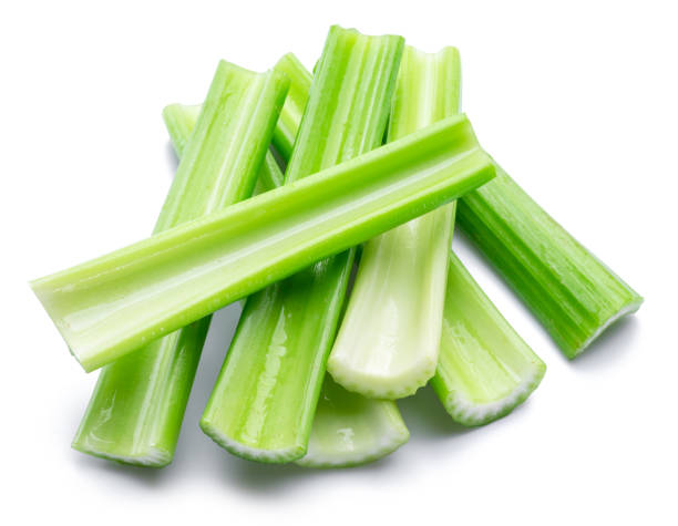 istock Pile of celery ribs isolated on white background. 1366923045
