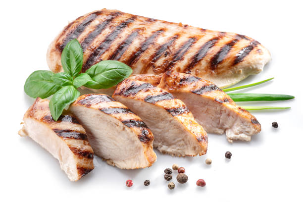 istock Grilled chicken fillet with herbs isolated on white background. 1366923089