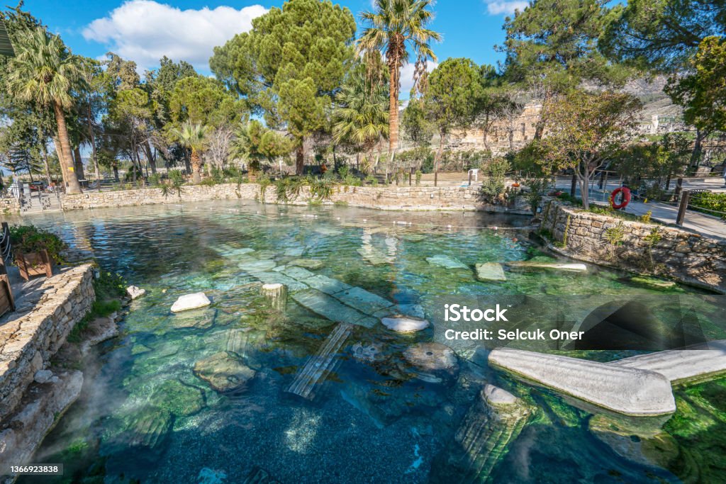 Pamukkale‘s Antique Pool, Denizli, Turkey Pamukkale‘s Antique Pool remains from Roman times, when it was the spiritual center of the spa city of Hierapolis. Pamukkale Stock Photo