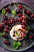 istock Burrata Cheese With Grilled Grapes and Basil Leaves 1366924342