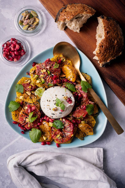 istock Burrata Salad with Mandarin Oranges and Pomegranate. 1366924371