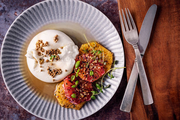 istock Burrata Salad with Blood Oranges and Coriander Seeds 1366925257