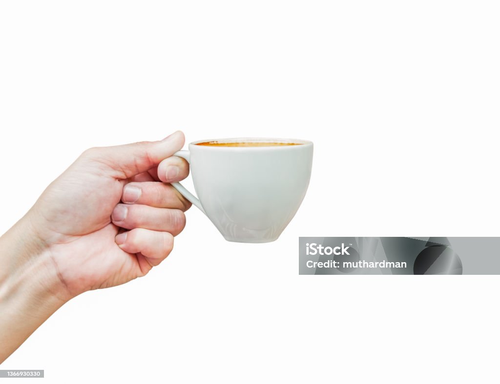Hot coffee cup in hand isolated on white background Front view of hot coffee cup in hand isolated on white background. Latte beverage in white mug the best start to any morning. Cut Out Coffee - Drink Stock Photo