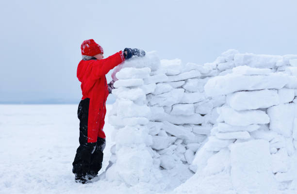 istock the boy and snow fortress 1366930972