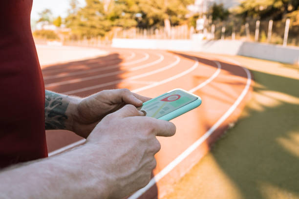 athlete man hand with app on mobile phone