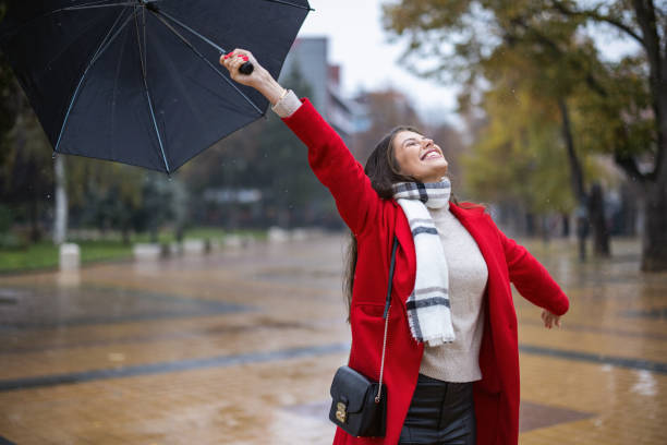 istock Young woman enjoying rainy weather 1366932575