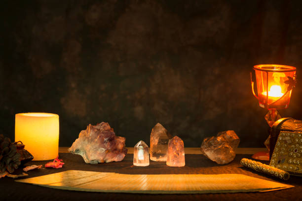 istock Tarot cards and other objects on a black card table. 1366933599