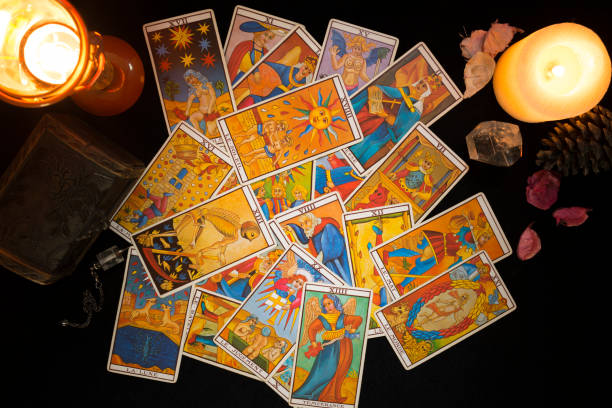 istock Tarot cards on a black card table. 1366933615