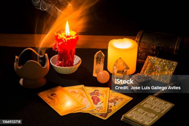 Still Life With Tarot Cards Candles Incense And Other Objects On A Black Card Table Stock Photo - Download Image Now