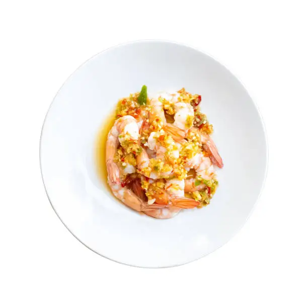 Photo of Spicy Shrimp Salad with Garlic chilli fish sauce and lemon in a plate isolated white background