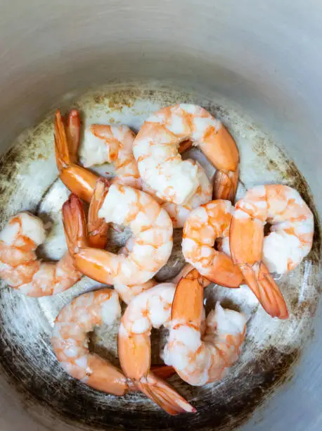 Photo of Boiled shrimp in a pot cooking preparation top view mobile photo