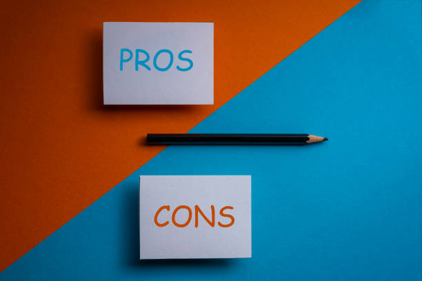 istock pros and cons decision making background ,for and against on blue and orange graphic background . 1366933891