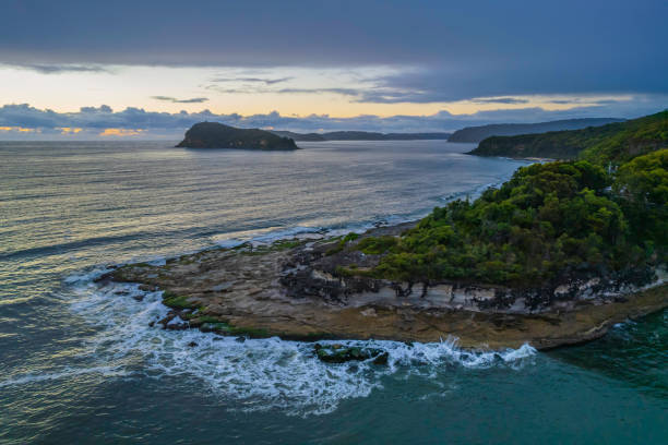 istock Aerial sunrise seascape with overcast sky and rain clouds 1366934220