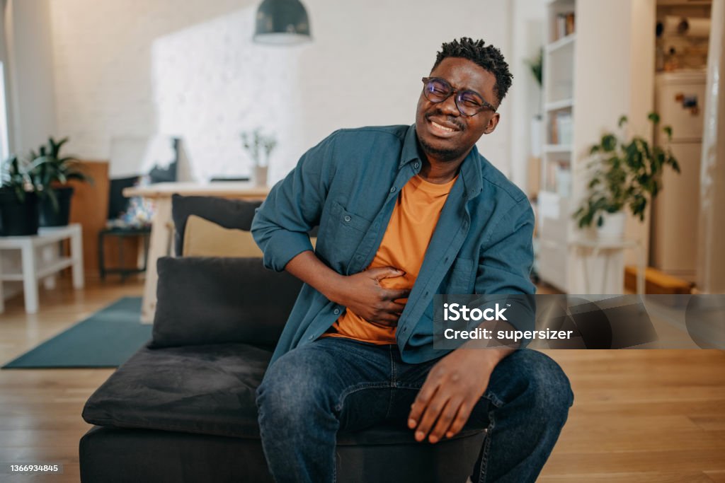 Young black man having pain Stomachache Stock Photo