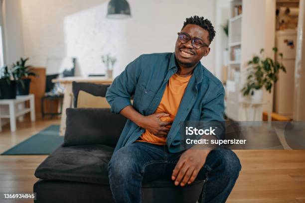 Young Black Man Having Pain Stock Photo - Download Image Now - Stomachache, Men, Ulcerative Colitis