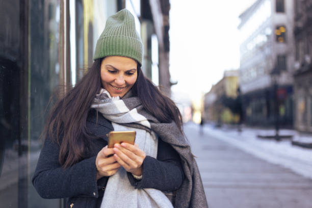 istock Woman checking bank account using mobile app 1366936703