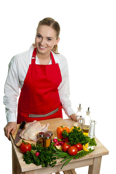 istock Young woman smiles preparing food 136693799