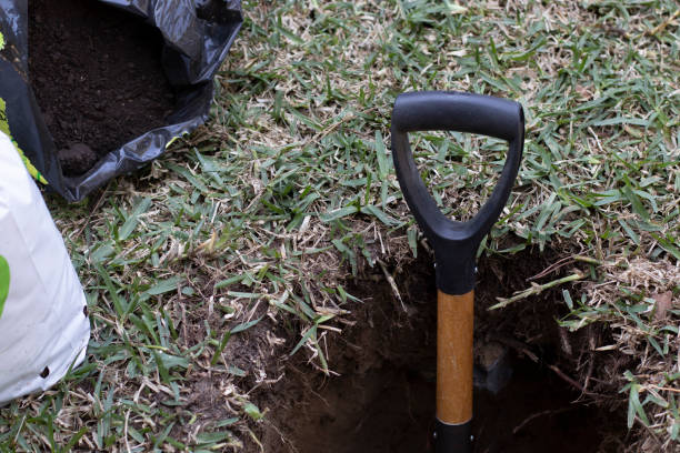 istock A shovel stuck in a hole 1366939426