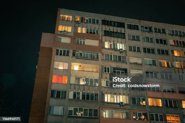 Exterior Architecture Of Apartment Block With Illuminated Windows At Night Stock Photo - Download Image Now