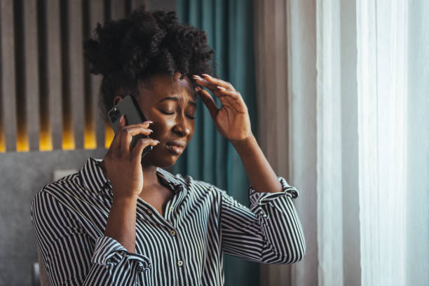 istock Outraged attractive employee talking on the phone 1366940653