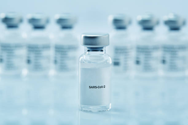 istock SARS-CoV-2 vaccine vials, bottles on white 1366941761