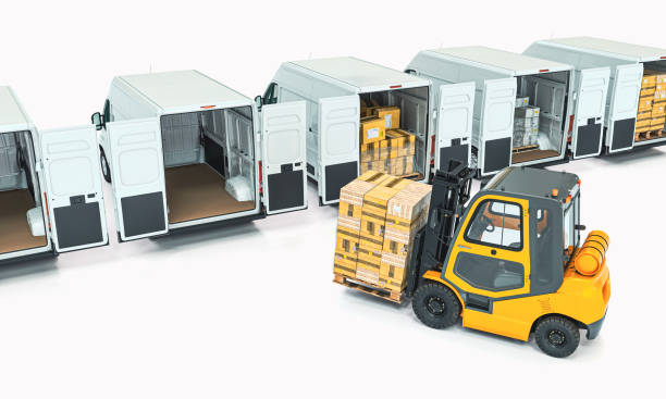 istock forklift loads packages onto white transport vans. 1366941903