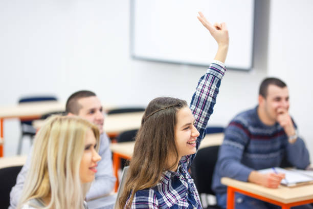 istock Young student in modern classroom listening to lecture. 1366942307