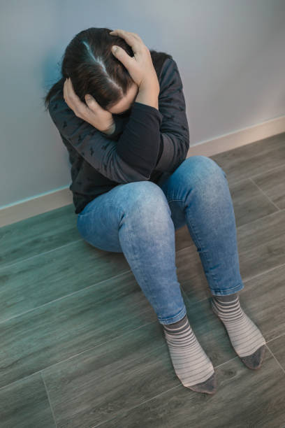 istock Unrecognizable woman with mental disorder and suicidal thoughts 1366944837