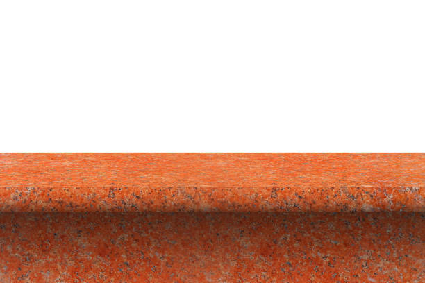 istock perspective of polished red granite tabletop   for interior and display show products. studio room isolated on white background 1366944952