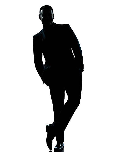 istock one business man standing Full length hands in pocket silhouette 136694580