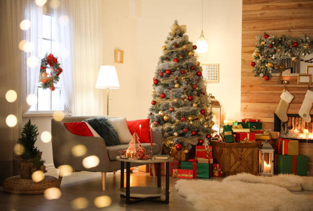 Beautiful Christmas tree in living room, bokeh effect. Festive interior