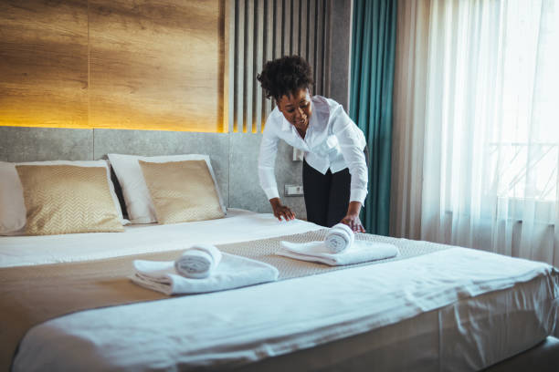 istock Maid working making the bed at a hotel. 1366946955