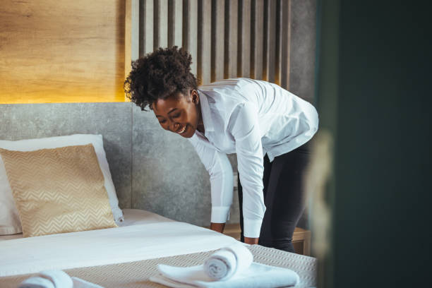 istock Maid working making the bed at a hotel. 1366947043